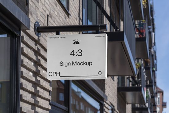 Urban outdoor sign mockup hanging on a building. Realistic street view for branding display with a 4:3 aspect ratio.